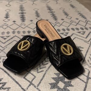 Valentino Black Mules with Gold Emblem